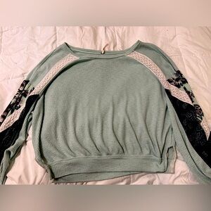 Free People sweater with floral and lace sleeves